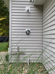 Outdoor shower (the grasses grow taller through the summer)